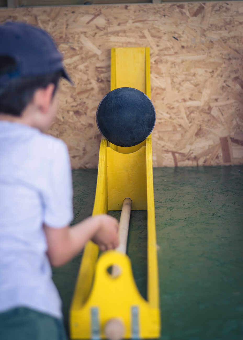 child playing a throwing game