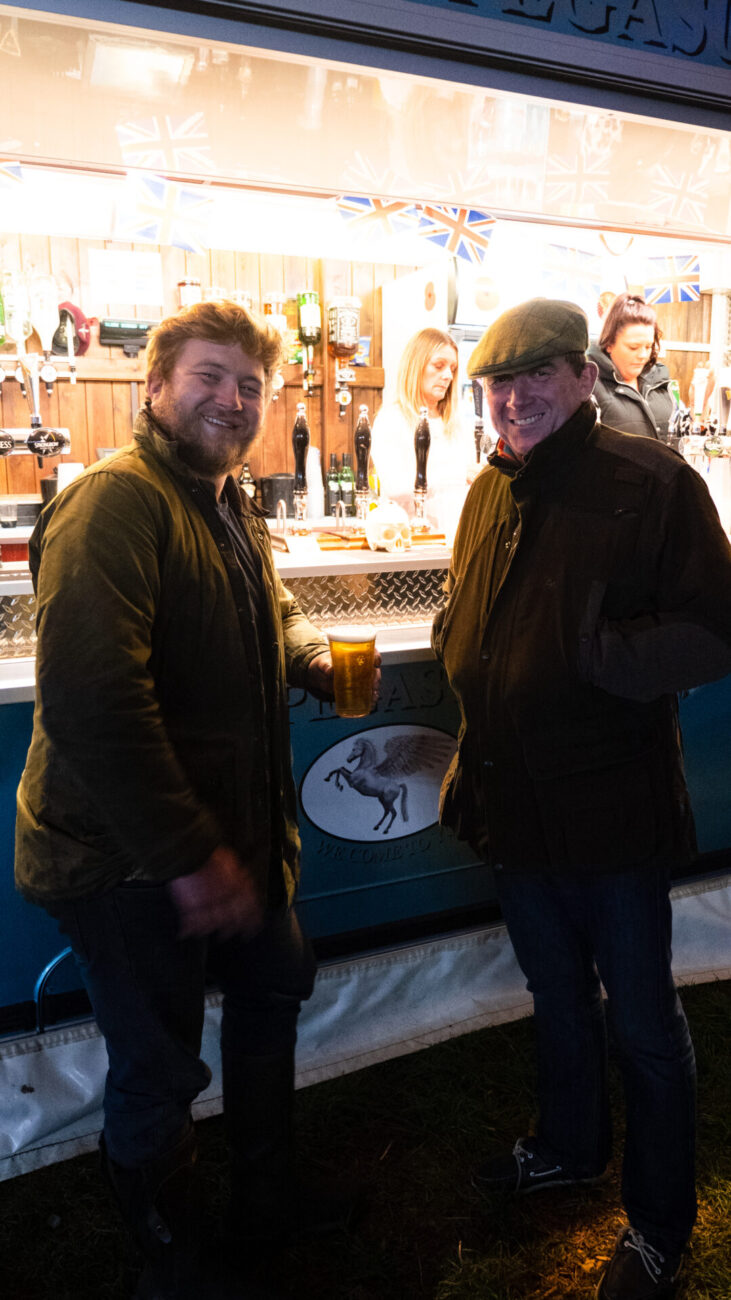two men enjoying a beer at the patch mk